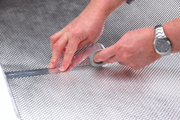 Cool_Tape_Sealing_FT_seam_with_hands_96535 Floor & Tunnel Shield II™ 106cm x 122cm - (42" x 48") DEI-50503